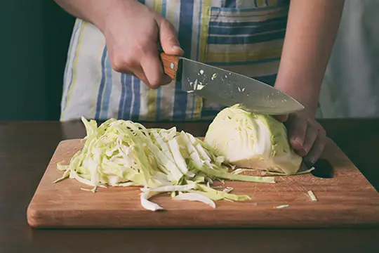 cutting-cabbage-to-make-sauerkraut