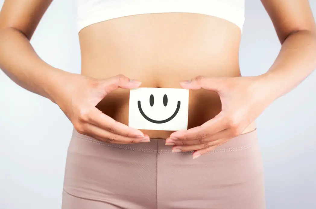 women with smiley near gut health