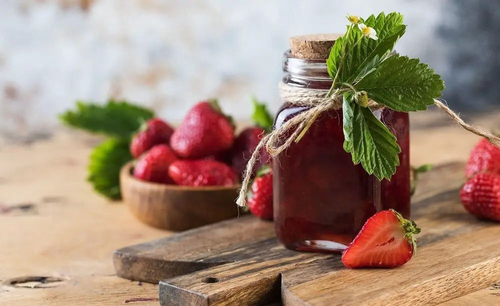 fermenting strawberries on wooden table